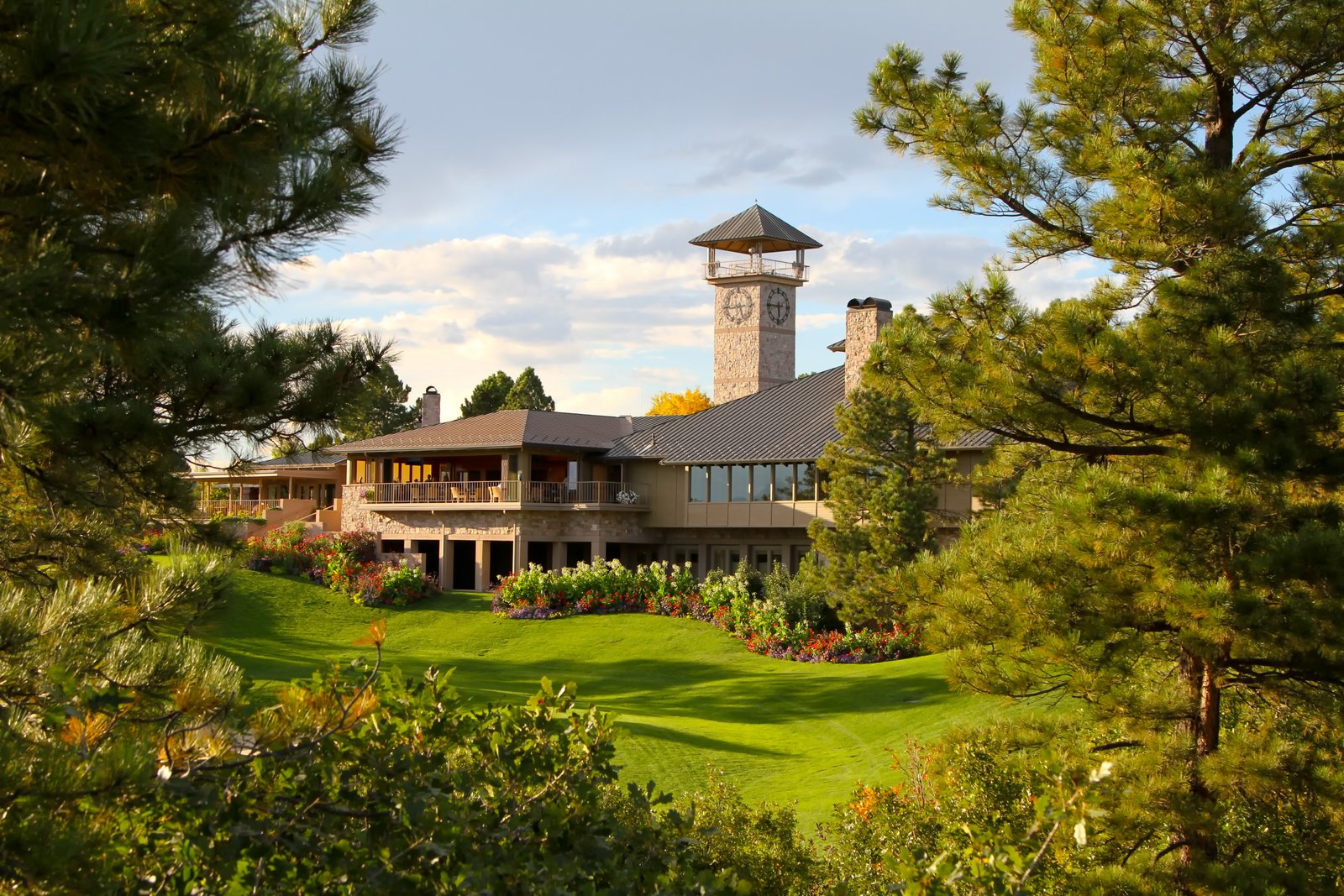 Castle Pines Golf Club, Colorado, fairway through Ponderosa pines below the Rockies