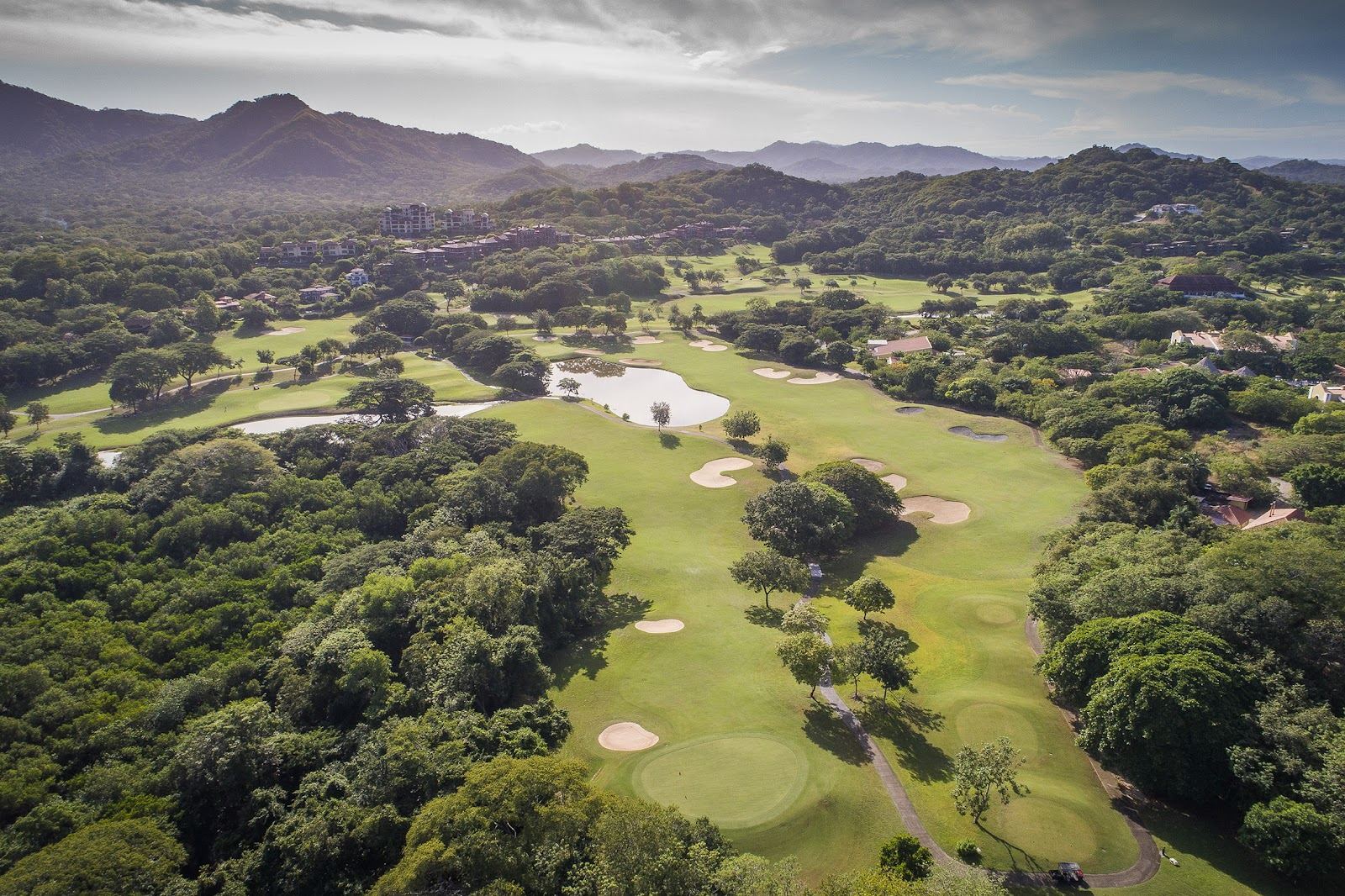 Reserva Conchal golf course, green fairways against tropical dry forest near Playa Conchal on Costa Rica's Pacific coast