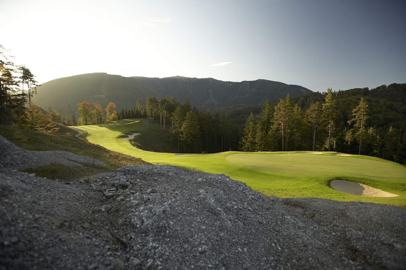 Golf Club Adamstal, mountain hole dropping through forest in the Lower Austrian Alps, Austria
