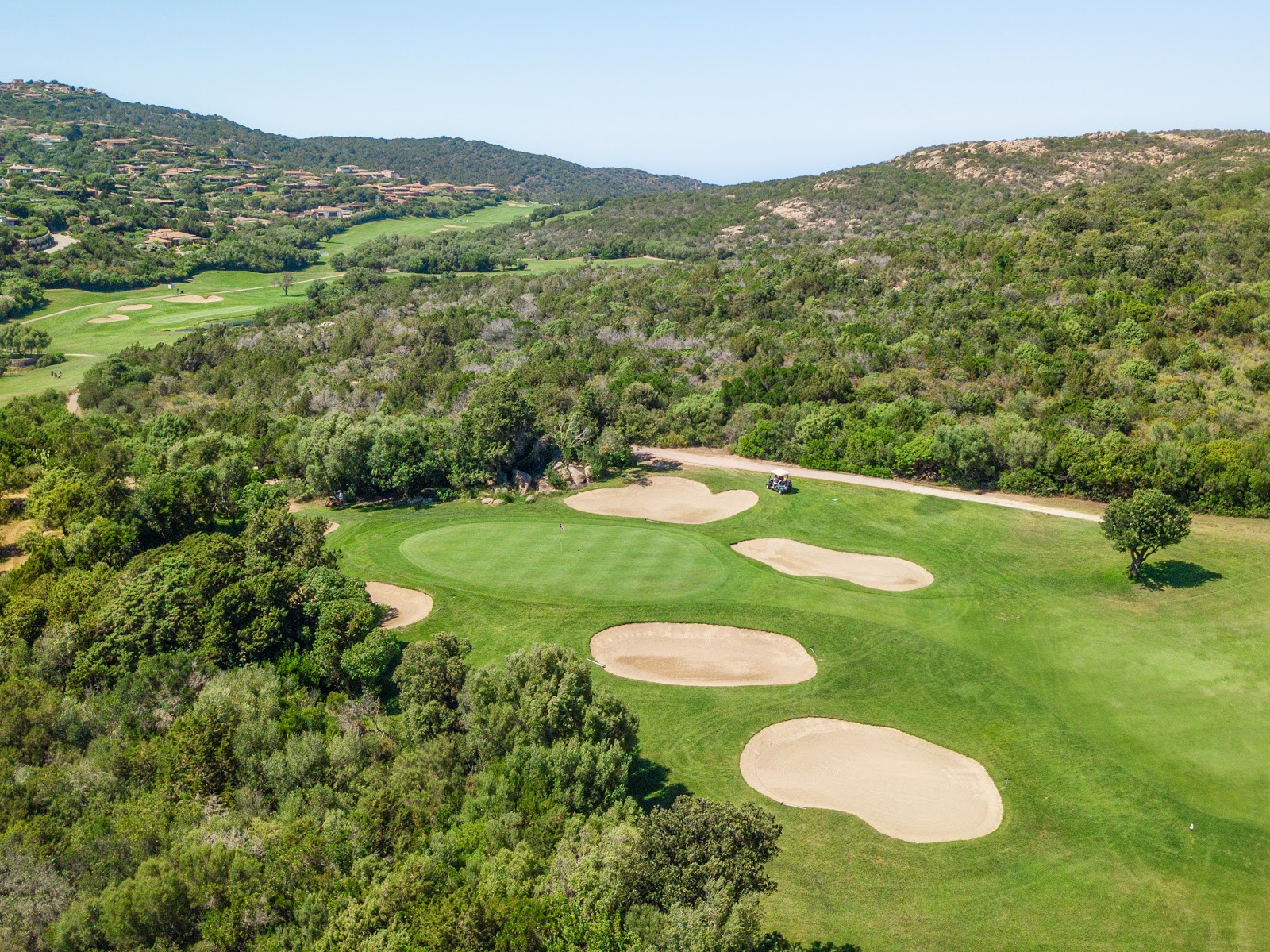Pevero Golf Club, fairway between granite outcrops and the blue bays of the Costa Smeralda, Sardinia