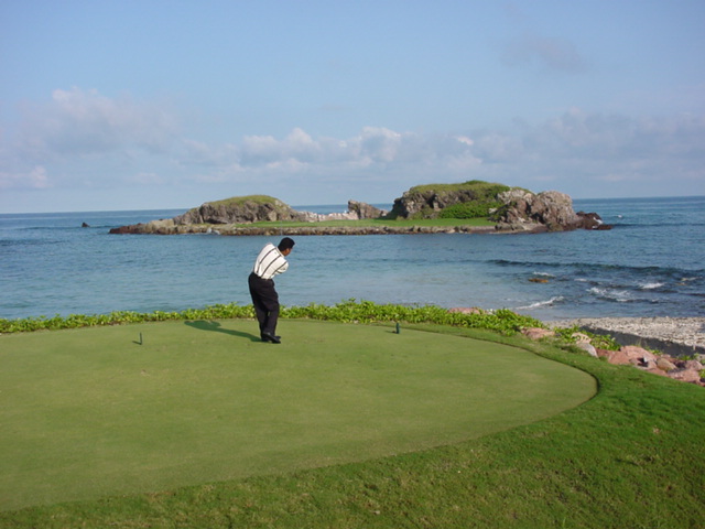 Punta Mita Pacifico Course, the Tail of the Whale par 3 with its natural island green offshore in the Pacific on Mexico's Riviera Nayarit