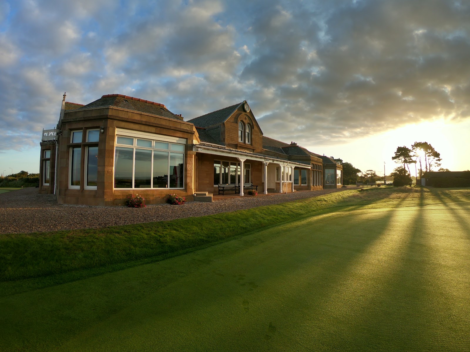 Royal Troon Old Course along the Ayrshire coast, with links fairways running out toward the Firth of Clyde