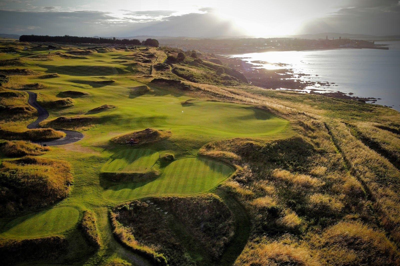 The Castle Course at St Andrews on the cliffs above the town, with rumpled fairways running toward the sea