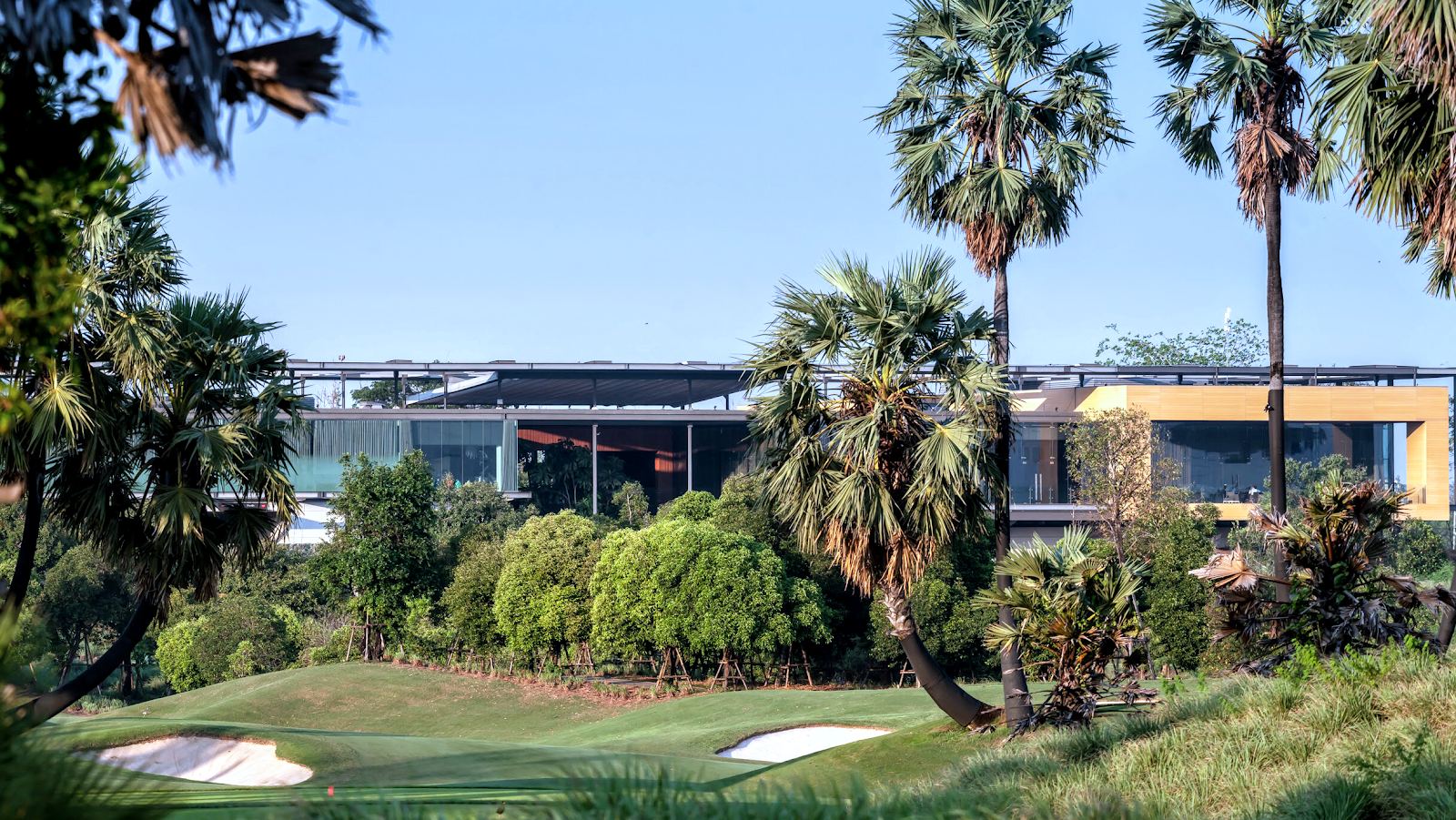 Nikanti Golf Club fairways and lakes on former rice paddies in Nakhon Pathom near Bangkok, Thailand