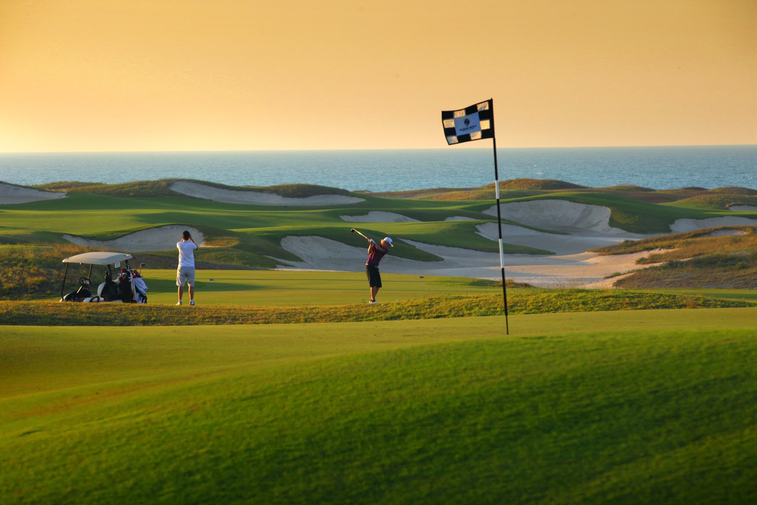 Saadiyat Beach Golf Club, fairways running between sandy dunes and the Arabian Gulf shoreline on Saadiyat Island, Abu Dhabi, United Arab Emirates
