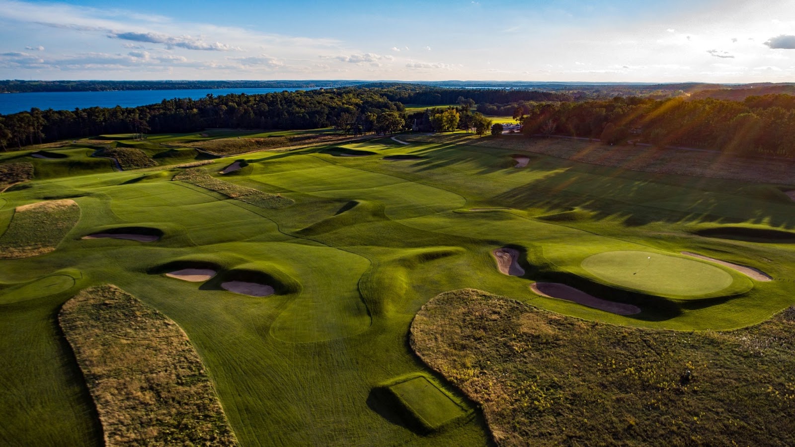 Lawsonia Links, a raised geometric green pad guarded by deep flat bottomed bunkers under a Wisconsin sky