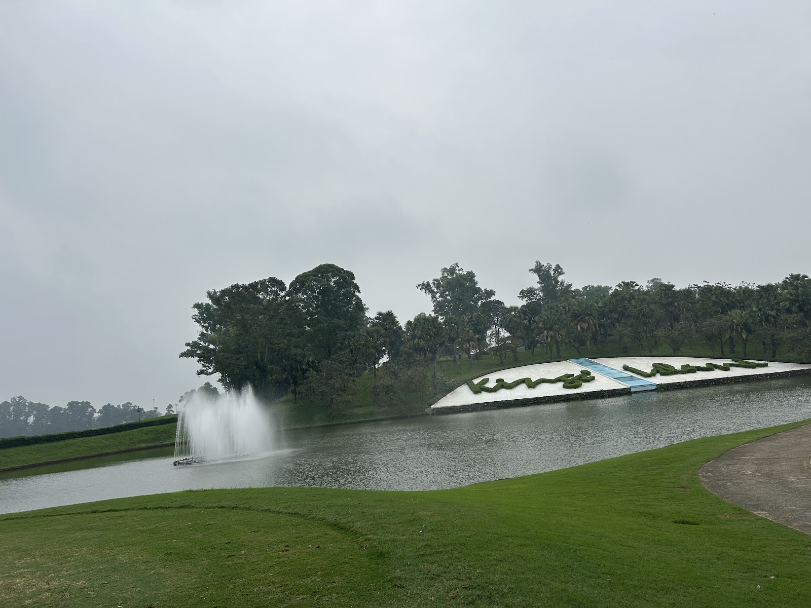 BRG Kings Island Mountainview Course near Hanoi, wooded fairway on a peninsula in Dong Mo lake below the Ba Vi mountain, Vietnam
