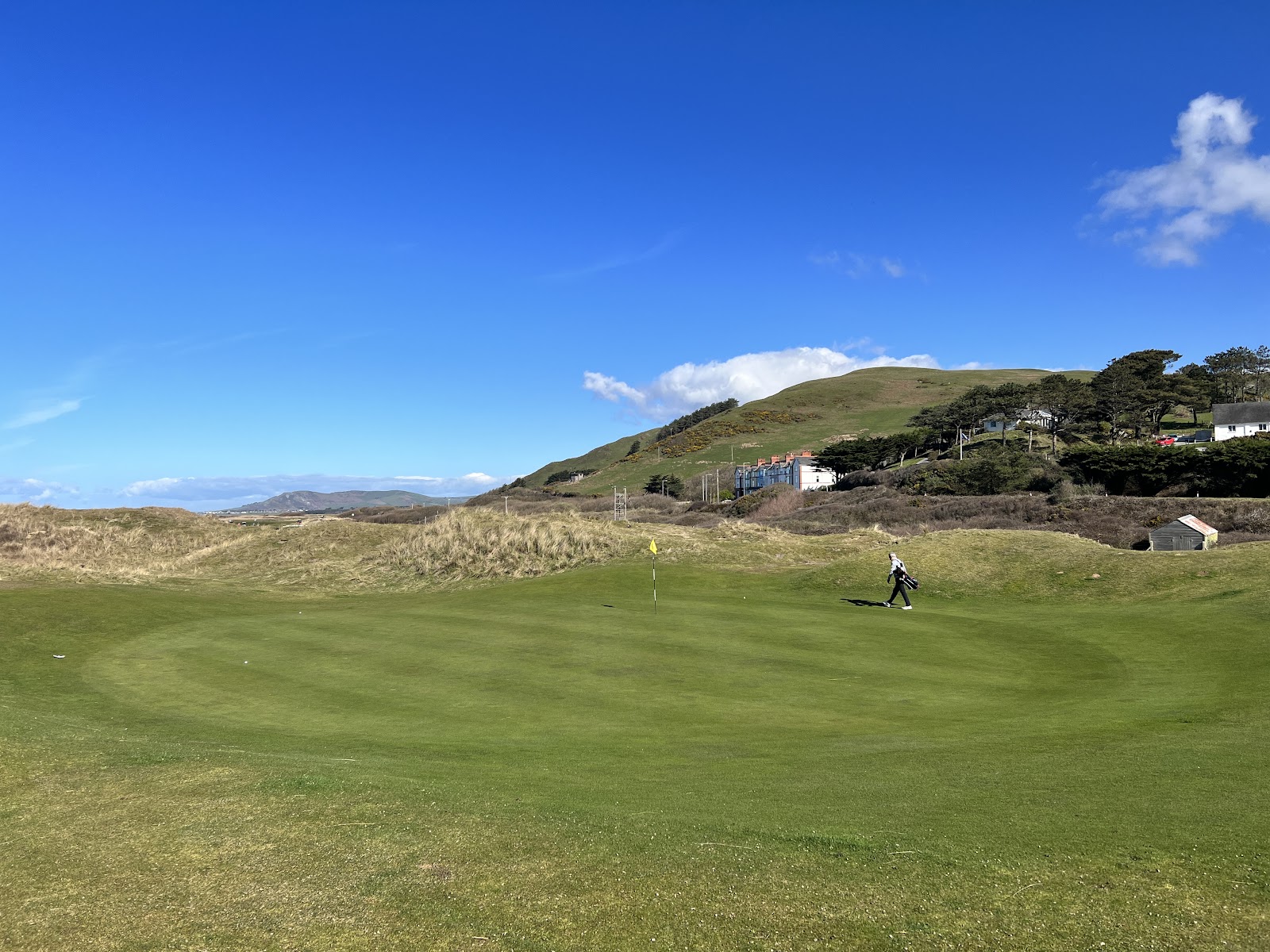 Aberdovey Golf Club links at the mouth of the Dovey Estuary in Gwynedd, dunes and fairways with the hills of Snowdonia beyond