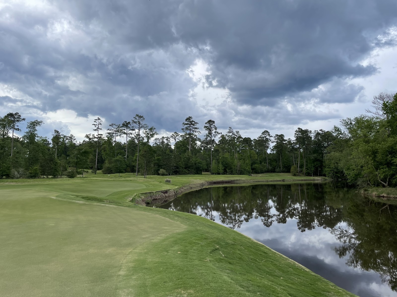 Whispering Pines Golf Club, pine framed fairway and water in East Texas