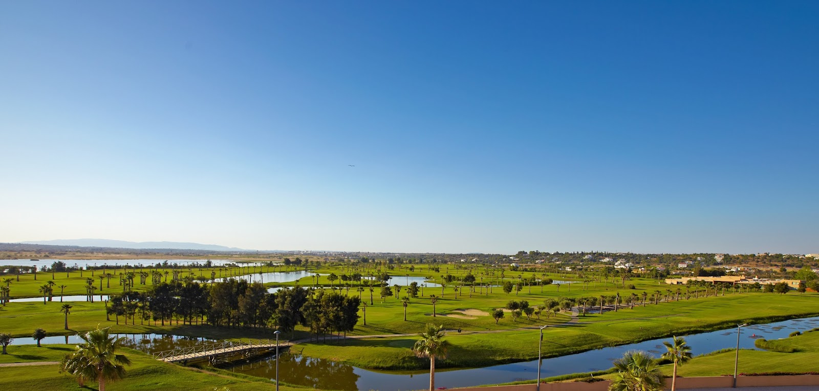 Salgados Golf Course on the Algarve, Portugal, a links style fairway beside the wetlands and Atlantic coast