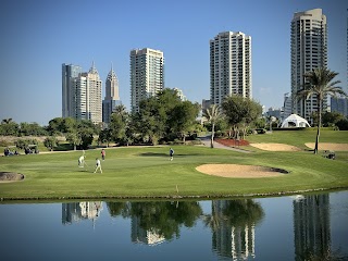 Jumeirah Golf Estates Earth course, manicured fairways and lakes in Dubai