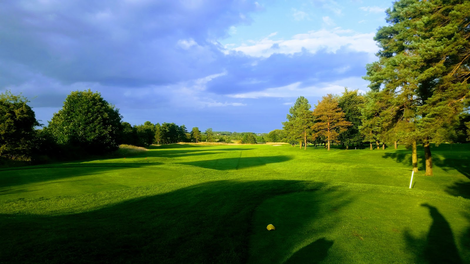 Minchinhampton Golf Club, rolling Cotswolds fairways above the village of Avening